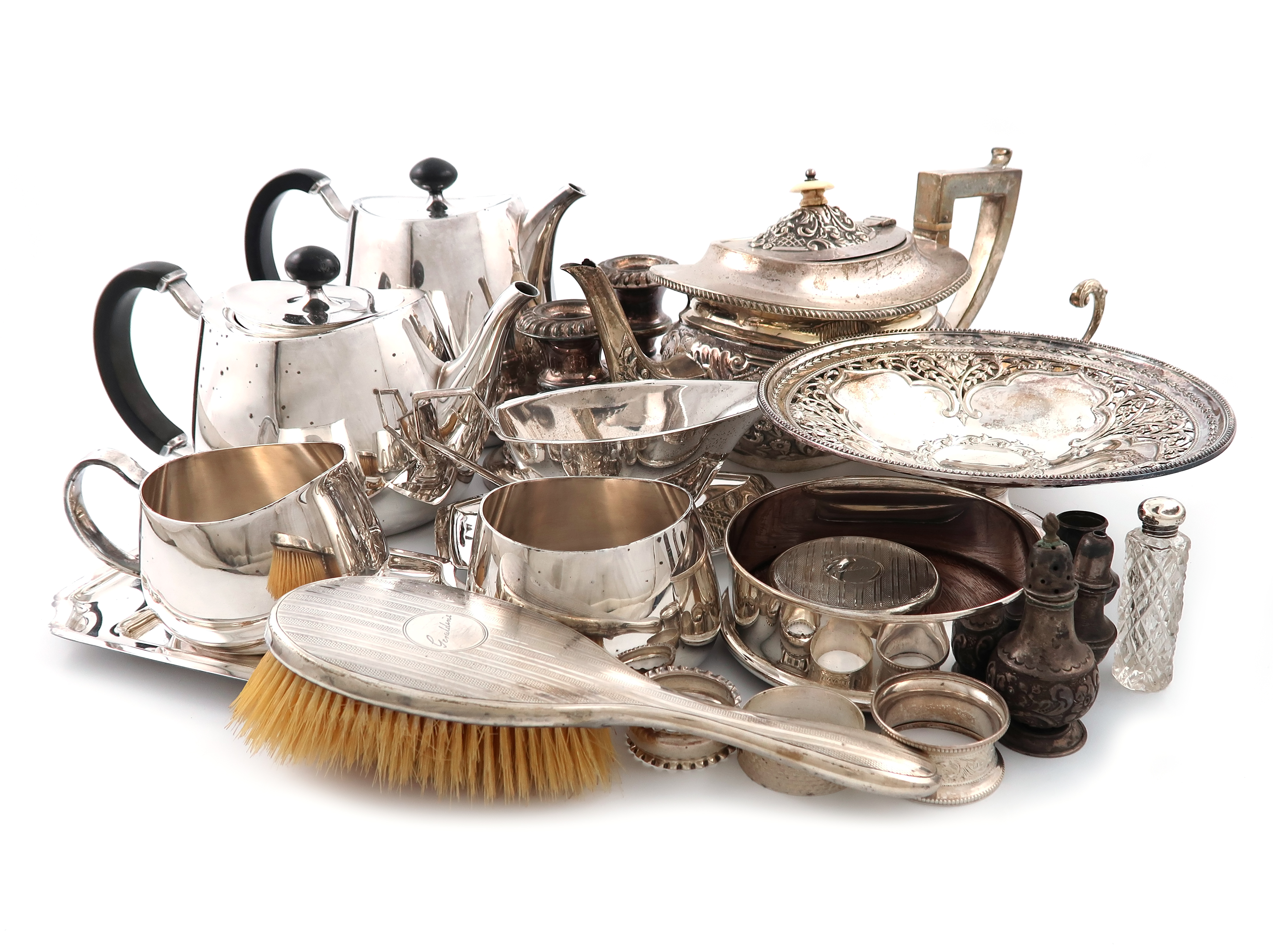 λA mixed lot, comprising silver items: a teapot, Birmingham 1902, of rounded rectangular form,