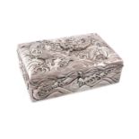 A Chinese silver box, rectangular form, the hinged cover embossed with a dragon within scroll waves,