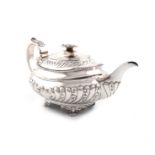 λA George IV silver teapot, by Thomas Death, London 1824, oblong bellied form, part-fluted and