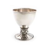 By Omar Ramsden and Alwyn Carr, an Arts and Crafts silver goblet, London 1907, circular spot-