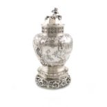 A late-Victorian silver tea caddy and stand, by the Goldsmiths and Silversmiths Company, London