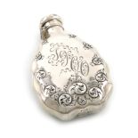 By Tiffany and Co., a 19th century American silver hip flask, 1891-1902, shaped oval form, chased
