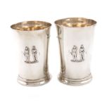 A matched pair of silver beakers, by Elkington and Co., Birmingham 1922/23, tapering circular