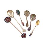 A mixed lot of silver spoons, comprising: a pair of Norwegian silver-gilt and enamel spoons, by