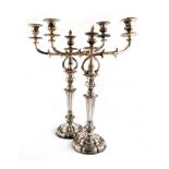 A pair of early 19th century old Sheffield plated three-light candelabra, unmarked, circa 1830,