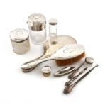 A mixed lot of silver dressing table items, comprising: a large late-Victorian silver-mounted jar,