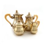 λA four-piece French silver-gilt bachelor's tea and coffee set, circa 1900, by R.L crowned for