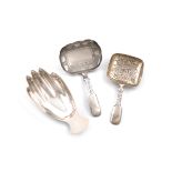 A small collection of three silver caddy spoons, comprising: one modelled as a hand, by F. Howden,