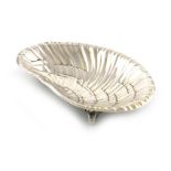 By Tiffany and Co. an American silver dish, Edward Moore period, modelled as an oyster, on three