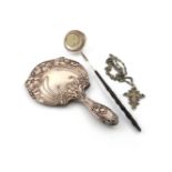 λA mixed lot of silver items, comprising: an Edwardian Art Nouveau hand mirror, by The Boots Pure