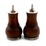 By Leslie Durbin, a pair of Arts and Crafts silver mounted wooden pepper mills, London 1953,