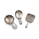 A George III silver Bright-cut caddy spoon, by John McFerlan, London 1785, shell shaped bowl, plus a