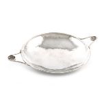 By A. E. Jones, an Arts and Crafts silver two-handled dish, Birmingham 1916, circular form, spot-