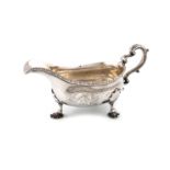 A Victorian silver sauce boat, by Frederick Brasted, London 1887, oval form, leaf capped scroll