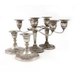A pair of Edwardian dwarf silver candlesticks, by The Goldsmiths and Silversmiths Company, London