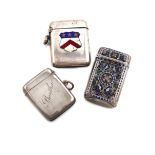 A Norwegian silver and enamel vesta case, rectangular form, with vari-coloured foliate decoration,