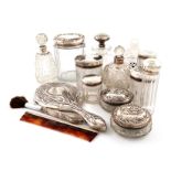 λA mixed lot of silver-mounted dressing table jars and bottles, comprising: a Tiffany scent
