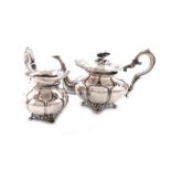 λA 19th century Dutch silver tea pot and cream jug, maker's mark of S & Co., 1850, lobed circular