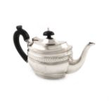An Edwardian silver bachelor's teapot, by Nathan and Hayes, Chester 1904, oval form, scroll