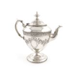 λA Victorian silver teapot, by Messrs. Lias, London 1872, vase form, embossed foliate decoration,