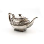λA George III silver teapot, by Crispin Fuller, London 1817, oblong bellied form, with a band of