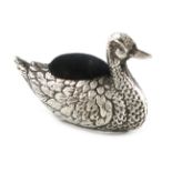 A novelty silver duck pin cushion, possibly by H J Cooper & Co Ltd, Birmingham 1920, modelled in a