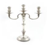 A modern silver three-light candelabrum, by R. Comyns, London 1962, in the George I manner,