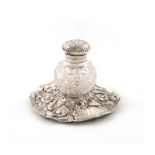 A Victorian silver inkstand, by Charles Boyton, London 1888, circular form, embossed with foliate