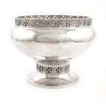 By A. E. Jones, an Arts and Crafts silver bowl, Chester 1922, circular bellied form, cast and