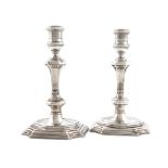 A matched pair of George II Irish cast silver candlesticks, probably by Phillip Kinnersly or Peter