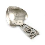 By A .E. Jones, a silver Art Nouveau caddy spoon, Birmingham 1915, heart-shaped bowl, the handle