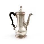 A George III silver coffee pot, possibly by Abraham Portal, London 1765, baluster form, scroll