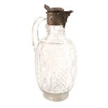 A Victorian silver-mounted cut glass claret jug, by Brockwell & Son, London 1885, ovoid form, the