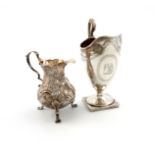 A George III silver cream jug, by Robert Hennell, London 1792, helmet form, engraved decoration,