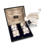 A cased set of four silver napkin rings, by Martin, Hall and Co, Sheffield 1918, retailed by The