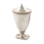 A George III silver nutmeg grater, by William Parker, London 1800, urn form, the hinged cover with a