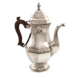 A silver coffee pot, by Carrington and Co., London 1919, octagonal baluster form, scroll handle,