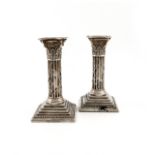 A pair of Victorian silver candlesticks, by The Harrison Brothers, Sheffield 1889, Corinthian column