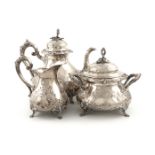 λA three-piece late 19th century Belgian silver tea set, circa 1880, baluster form, embossed with