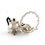 A late-Victorian silver teapot, by Charles Piling, London 1900, baluster form, wavy-edge border,