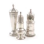 A small mixed lot of three silver casters, comprising: a George III pepper pot, by Samuel Woods,
