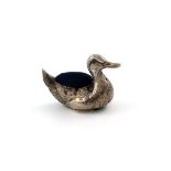 A novelty silver duck pin cushion, by Crisford and Norris, Birmingham 1922, modelled in a swimming