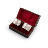 By the Keswick School of Industrial Arts, a pair of Edwardian silver napkin rings, Chester 1908,