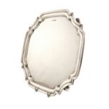 A silver salver, by Walker and Hall, Sheffield 1949, shaped square form, moulded border, on four bun