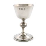 By Omar Ramsden, an Arts and Crafts silver small travelling communion cup, London 1935, also