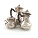 A three-piece French silver coffee set, by Cardeilhac, Paris, swirl fluted baluster form, scroll