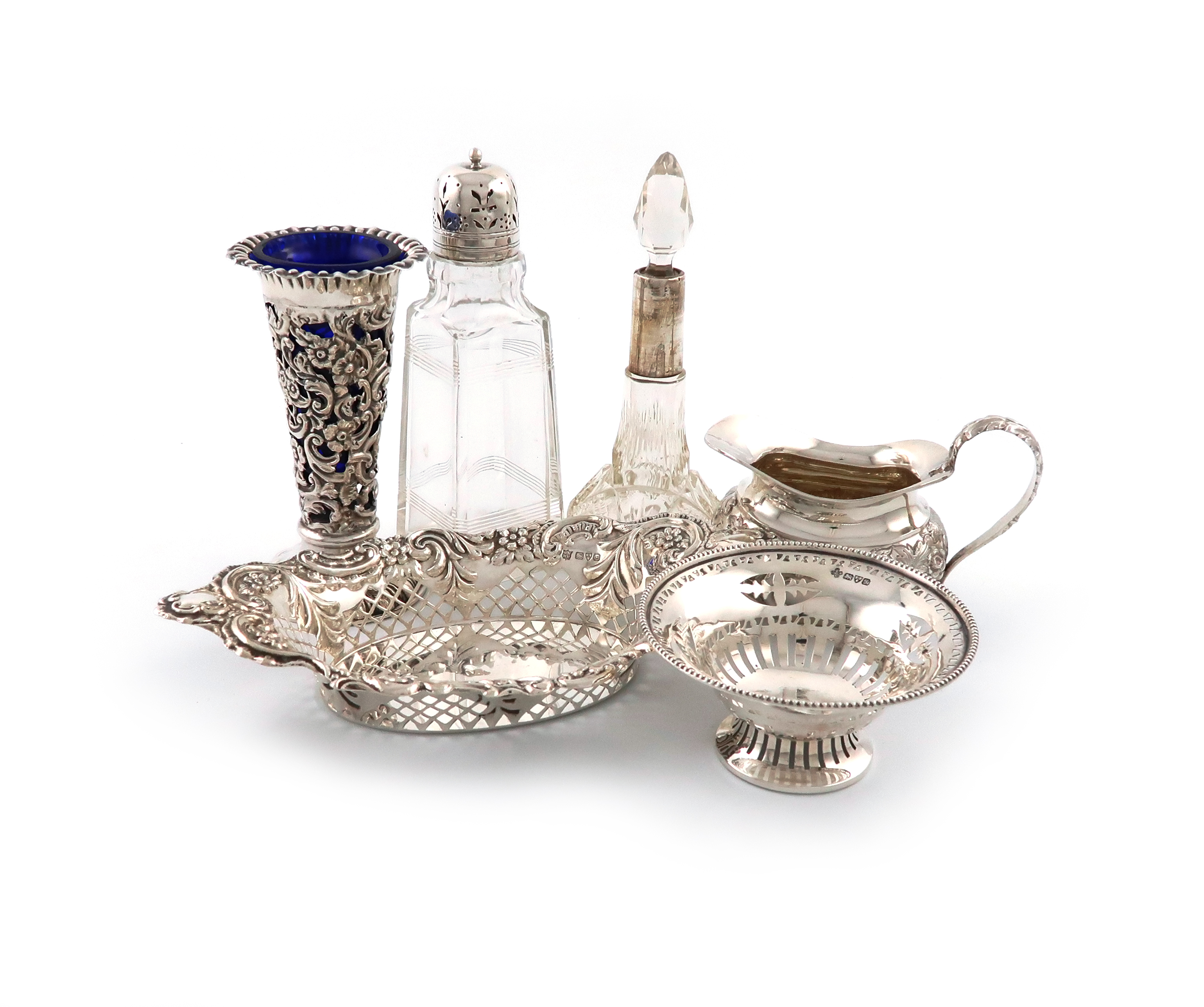 A mixed lot of silver items, various dates and makers, comprising: a late-Victorian cream jug, by