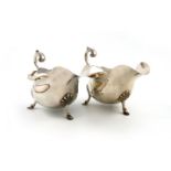 A pair of silver sauce boats, by Walker and Hall, Sheffield 1927, oval form, wavy-edge border,