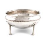 By A. E. Jones, an Arts and Crafts silver bowl, Birmingham 1912, circular form, spot-hammered