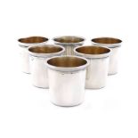 A set of six French silver tot cups, maker's mark of C.T, tapering circular form, gilded